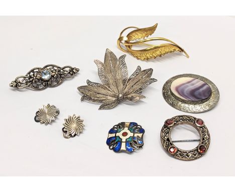 A collection of vintage silver brooches, with a pair of silver earrings and rolled gold brooch. 