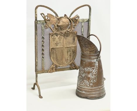 A Victorian wrought iron firescreen and a Victorian copper coal scuttle. 