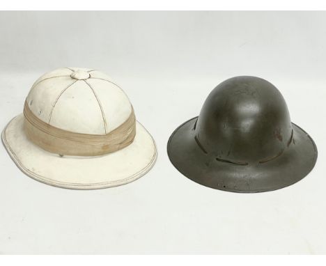 A British Tropical Royal Naval Military helmet and a British WW2 helmet. 