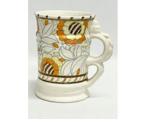 A 1930’s Charlotte Rhead pottery vase with handle. Designed for Crown Ducal. 18x13x18cm 
