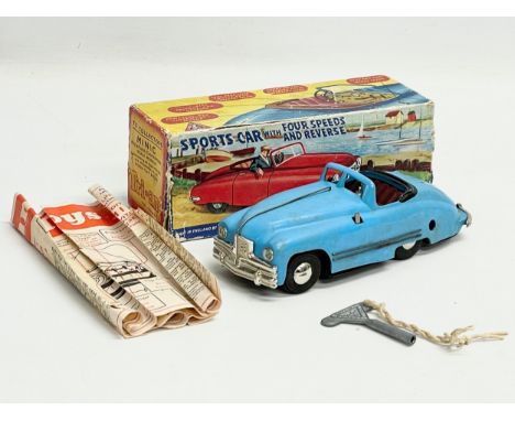 A vintage Tri-ang No.2 Minic Clockwork Scale Model Sports Car in box. Lines Bros LTD. With Four Speeds and Reverse. 