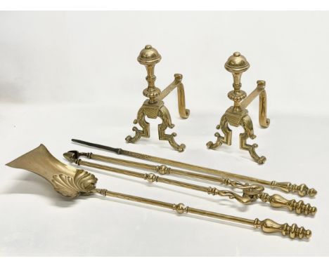 A set of good quality Victorian brass firedogs and tools. Tools measure 70cm 
