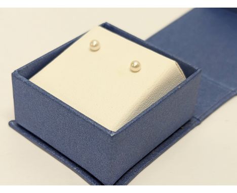 A pair of small 9ct gold and pearl earrings 