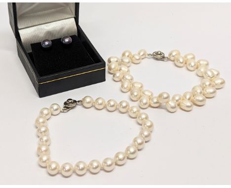 2 pearl bracelets with a pair of pearl earrings with silver backs. Measurements of bracelet open 20cm 