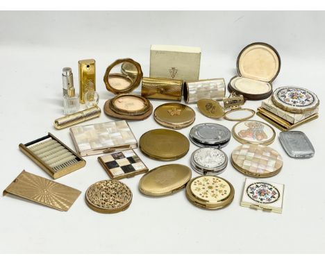 A collection of vintage compacts and perfume bottles 