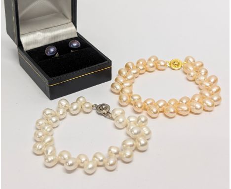 2 pearl bracelets with a pair of pearl earrings with silver backs. Measurements of bracelet open 19cm 