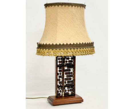 A vintage Abacus table lamp. Base measures 23x12x38cm 