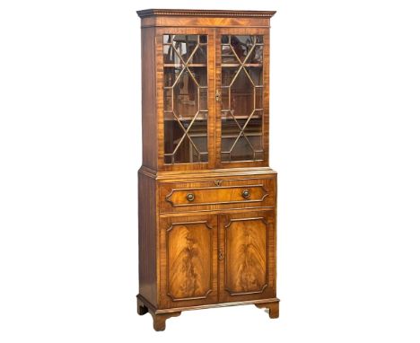A good quality Georgian style mahogany secretaire bookcase with astragal glazed doors on bracket feet. 75x38x182cm 