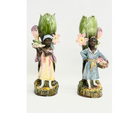 A pair of late 19th century French Barbotine Majolica figures. 6614. 30cm 