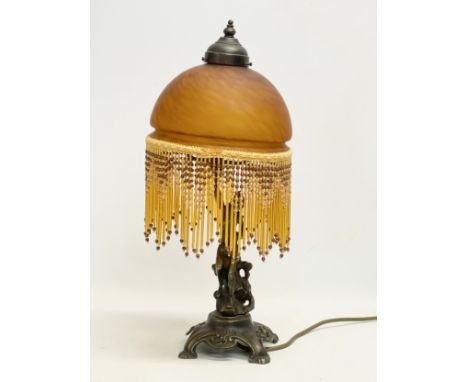 A vintage brass figurine table lamp with glass shade and droplet. 47.5cm 