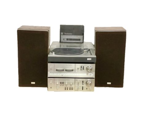 A vintage Toshiba music system. A Toshiba Direct Drive Turntable SR-255 with speakers and Toshiba PLL/Stereo Tuner Model ST-4