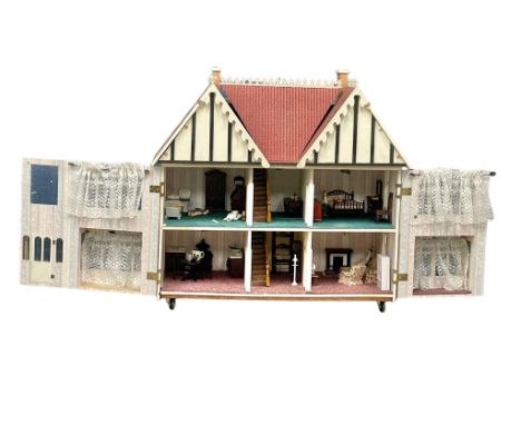 A large vintage dolls house and contents. 89x48x86cm 