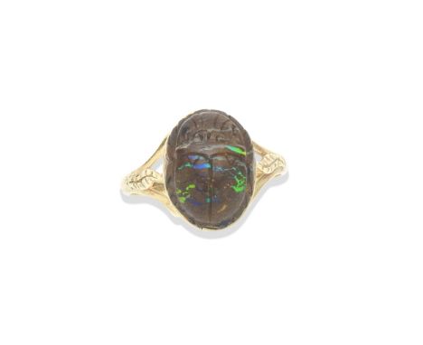 A boulder opal scarab, 19th-20th centuryEngraved on reverse, in a later ring mount, ring size P, length 15mm, width 10mmFootn