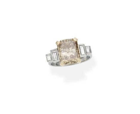 Coloured diamond ringThe step-cut diamond, weighing 5.56 carats, of brown tint, between graduating step-cut diamond shoulders