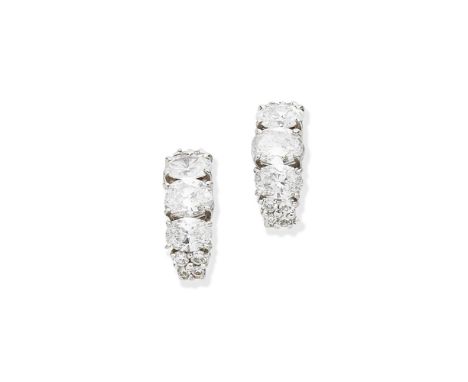 Van Cleef &amp; Arpels: diamond earringsSet to the front with a trio of oval-cut diamonds between brilliant-cut diamonds, dia