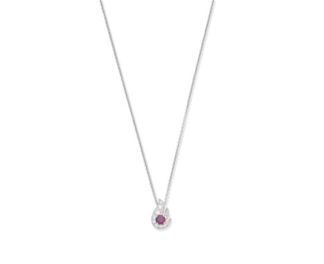 Graff: ruby and diamond Flame pendantThe circular-cut ruby, weighing 0.52 carat, within a surround of brilliant-cut diamonds,