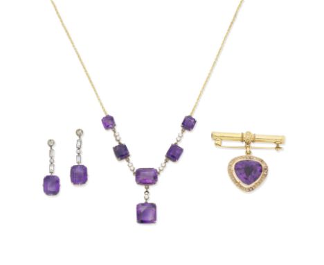 Amethyst necklace, earring and brooch suite1st: The cable link chain set to the front with graduating step-cut amethysts with