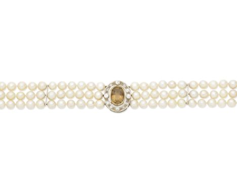 Citrine and cultured pearl chokerThe three strands of 9.5mm to 9.9mm cultured pearls with a central oval-shaped citrine withi