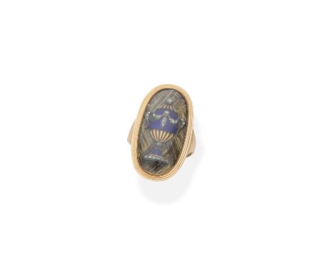 Enamel, diamond and hairwork mourning ring, circa 1789The applied blue enamel funerary urn accented by rose-cut diamonds on a