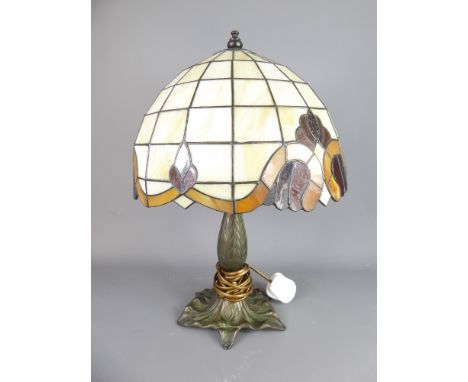 A Tiffany-Style Lamp with Art Nouveau-design coloured glass shade, approx 45 x 33 cms.