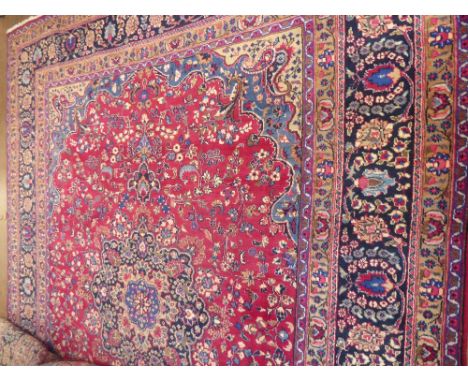 A Large 20th Century Persian Wool Carpet, jewel colours of foliate design, approx 317 x 250 cms. (good condition)