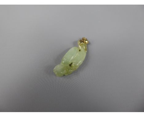 A Pale Celadon Green Jade Pendant, depicting entwined fish, on a 14ct gold mount, approx 40 x 15 mm.