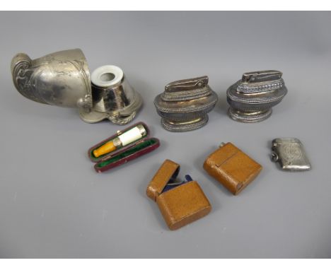 A Gentleman's Lot, including two Vintage Ronson Lighters, an antique travel inkwell in hinged leather case, a spelter and cer