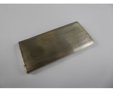 A Silver Metal Engine-Turned Cigarette Case and Match Strike, approx 9 x 4 cms.