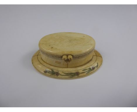 A 19th Century Ivory & Bone Snuff Box, the oval box having coloured design depicting flowers to both top and bottom edge of p