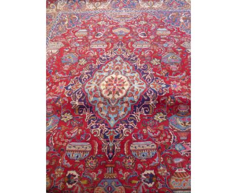 A Large 20th Century Persian Wool Carpet, jewel colours of foliate design, approx 393 x 280 cms.(good condition)