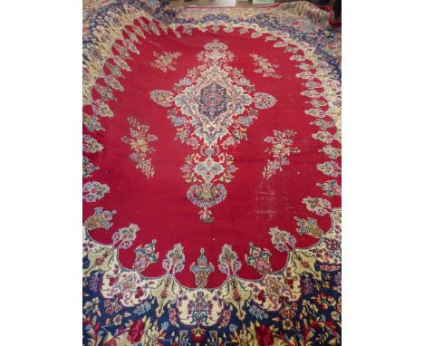 A Large 20th Century Persian Wool Carpet, primarily ruby and cobalt blue ground of foliate design, approx 467 x 347 cms, some