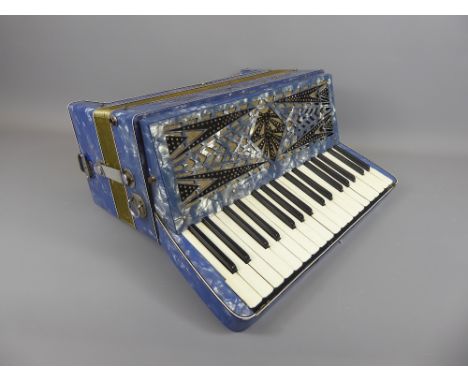 A Vintage Geraldo Italia 120 Bass 30 Key Piano Accordion, in working order, in blue mother of pearl finish.