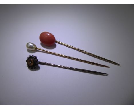 Three Antique Tie Pins, including pearl 18ct (tested), coral 14ct (tested) and rose cut diamond 14ct head 9ct pin (tested), a
