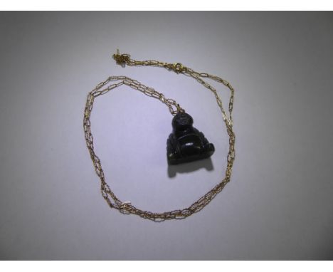 A Dark Green Carved Jade Buddha Pendant on 9ct yellow gold chain, chain approx 1.7 gms.