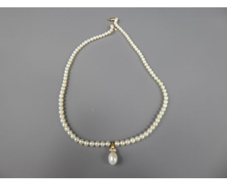 An 18ct Yellow Gold Diamond and Pearl Necklace, the necklace having a tear drop pearl with three diamonds above, pearl approx
