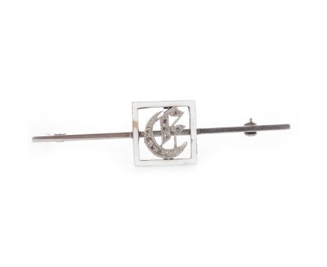 NINE CARAT GOLD INITIAL BROOCH
the square bezel with white enamel decoration, with central initial, set to a white gold bar, 