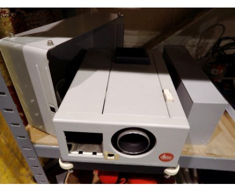 Leitz Pradovit 35mm slide projector with remote control &amp; slide racks. Type 315725, working. All electrical items in this