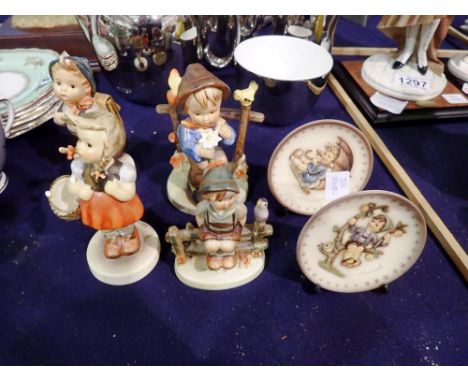 Four Goebel figures, one damaged, and two small decorative plates and stands. UK P&amp;P Group 3 (£30+VAT for the first lot a