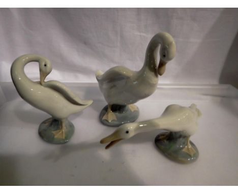 Three Nao and Lladro duck figurines. Not available for in-house P&amp;P 