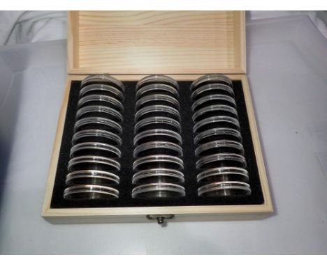 Wooden coin case presented with 30 capsules. UK P&amp;P Group 1 (£16+VAT for the first lot and £2+VAT for subsequent lots) 
