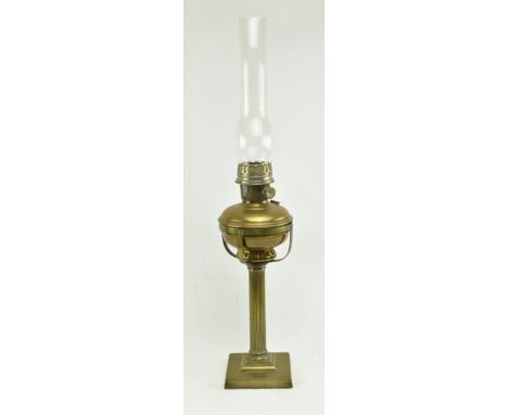 A 19th century Victorian Aladdin paraffin brass oil lamp with glass shade. The lamp over reeded brass column on stepped squar