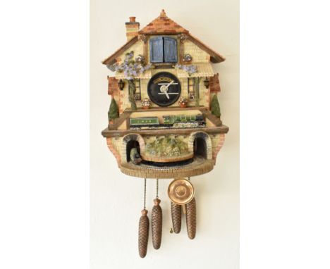 A Bradford Editions 'Memories of Steam' Flying Scotsman cuckoo clock. The clock featuring a train and tunnel beneath train st