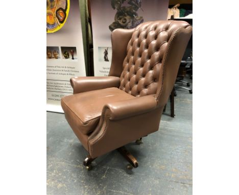 A BROWN LEATHER BUTTON BACK SWIVEL ARM CHAIR AND A RED LEATHER EXAMPLE SIMILAR. 