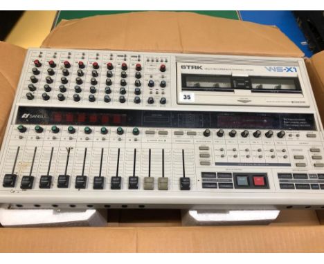 A SANSUI WS-X1 MULTI TRACK RECORDER 8 CHANNEL MIXER IN BOX