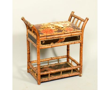 A 19c bamboo music seat with black lacquered chinoiserie decorated panels, having one galleried lower shelf, 25h.