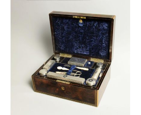 A mid Victorian gentlemans' travelling toilet box , manufactured and with label 'Lund, Cornhill, London', figured walnut and 