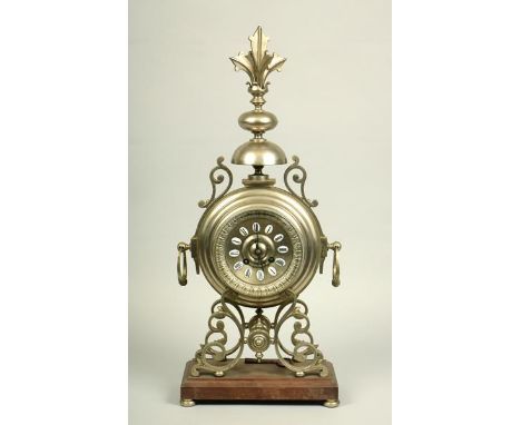 A late 19c French mantel clock in the form of a stepped drum supported on four cast scroll brackets on a hardwood base.  The 