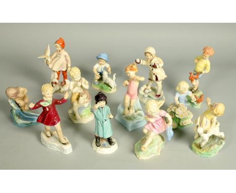 A complete set of twelve Royal Worcester Month of the Year figures, modelled by Freda Doughty, measuring from 4.75h to 7.5h.