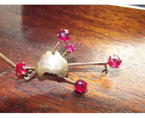 9ct gold brooch with 4 red stones, possibly ruby 