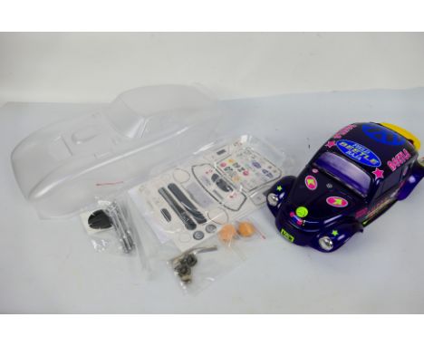 L&L Models - Kyosho - Two unboxed 1:10 scale RC body shells. Lot includes a painted Kyosho QRC 'Baja' Beetle; with a L&L Mode